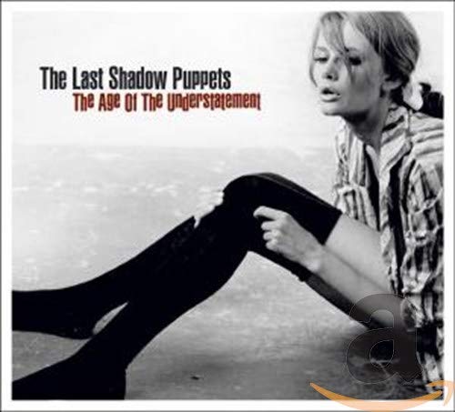 Black and white album cover featuring a woman with legs extended.