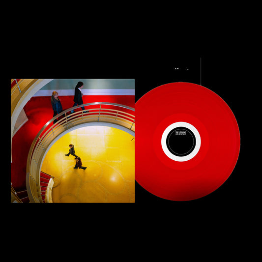 The Lathums album cover art next to a bright red vinyl record.