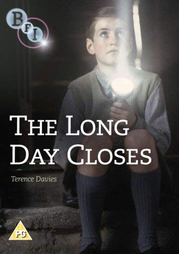 Boy with flashlight sits on steps, DVD cover for “The Long Day Closes.”