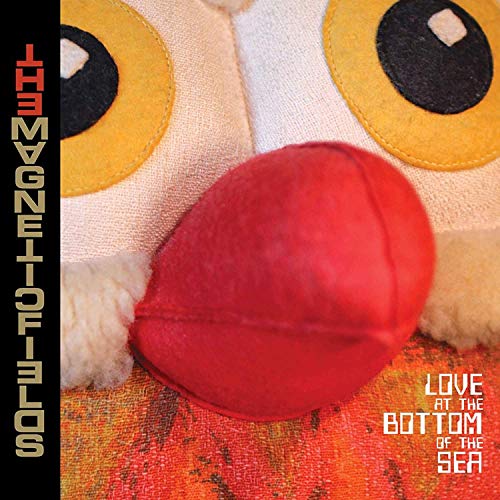Album cover for The Magnetic Fields, featuring a red fabric fish toy.