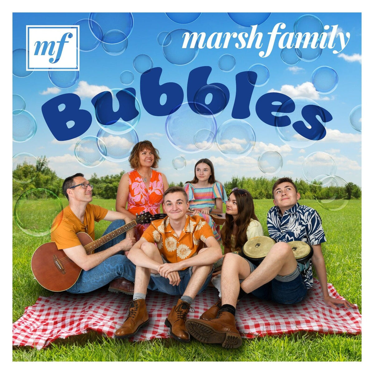 Family group "Marsh Family - Bubbles" CD cover with people on a picnic blanket.