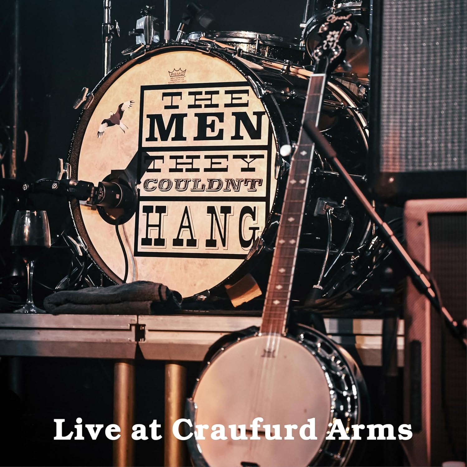 Drum kit with band name "The Men They Couldn't Hang" displayed.