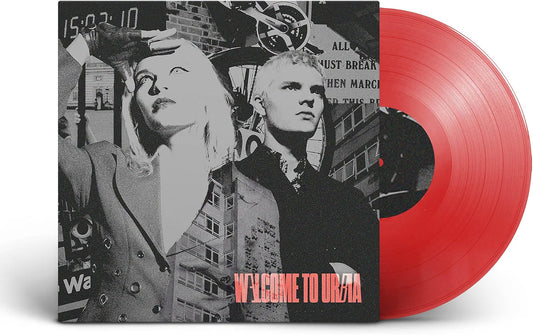 Vinyl record with album cover featuring two people and city imagery.