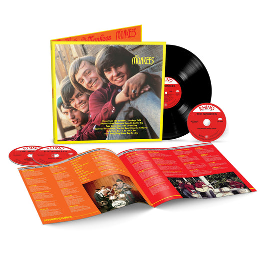 The Monkees album cover, vinyl record, and two accompanying CDs laid out.