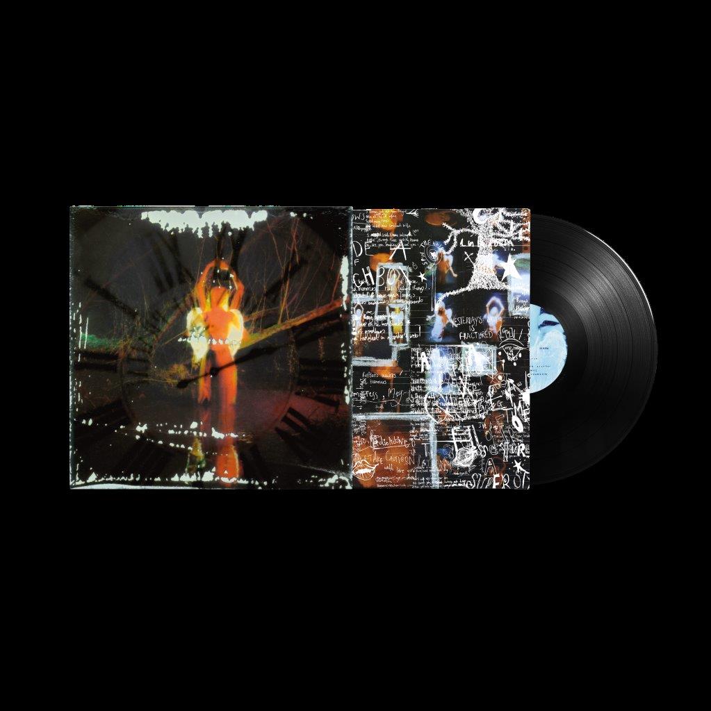 Vinyl record with album cover featuring abstract imagery and handwritten text.