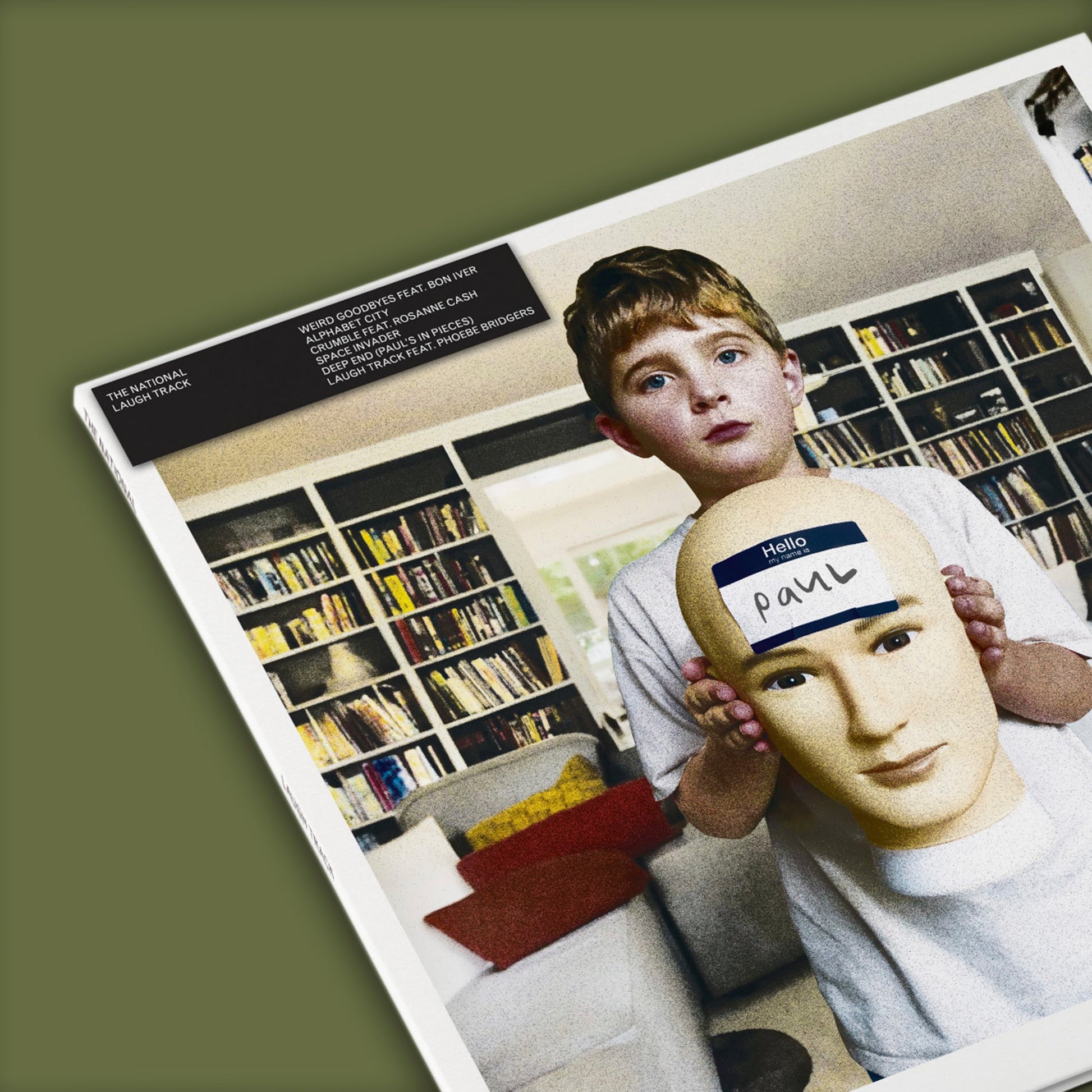 CD cover for The National’s “Laugh Track” featuring a boy with a bust.