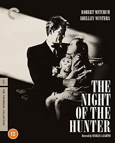 Black and white film cover showing a man holding a young girl with a doll.