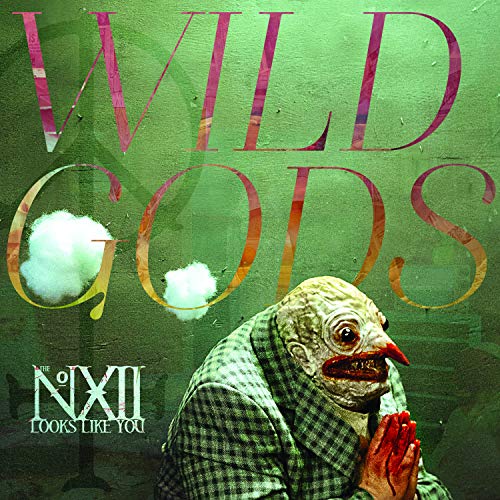 "Album cover with a grotesque, praying figure and green background, titled 'Wild Gods'."