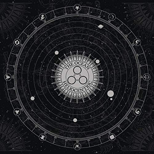 Black and white circular diagram featuring a central sun, planetary orbits, and zodiac symbols.