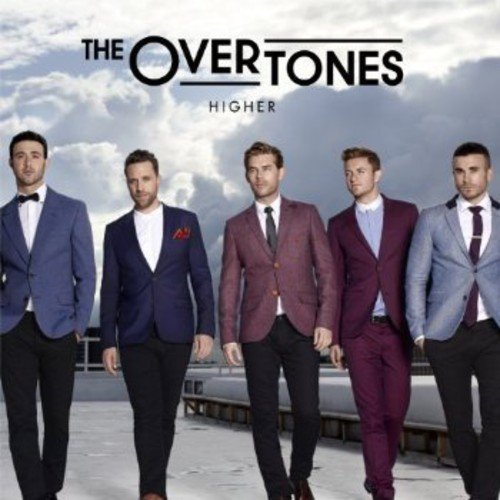 "CD cover featuring five men in suits against a cloudy sky background."