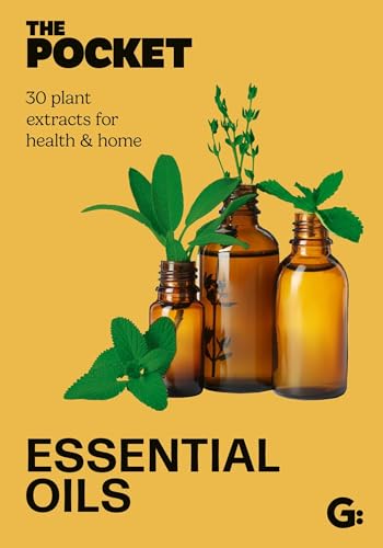 Book cover with amber essential oil bottles and green plant sprigs.