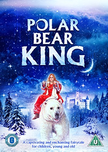 A woman in a red coat rides a polar bear before a snowy castle.