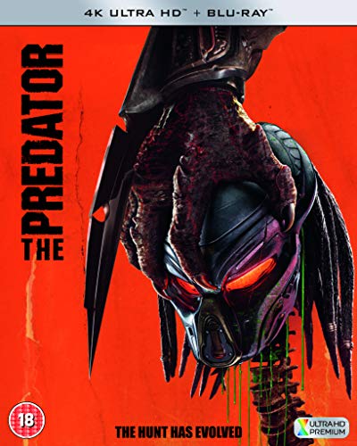 Predator movie cover: close-up of the alien’s mask and dreadlocks.