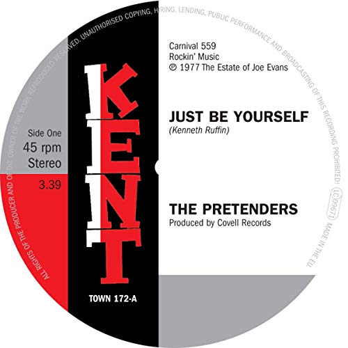 Vinyl record label with black, white, and red sections, displaying song title and artist.