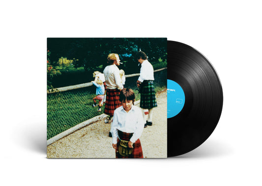 Vinyl record with cover showing children in kilts by a garden.