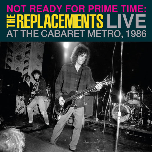 Black and white photo of The Replacements performing live onstage, 1986.