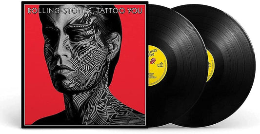 The Rolling Stones' "Tattoo You" vinyl album cover featuring a man with tribal face tattoos.