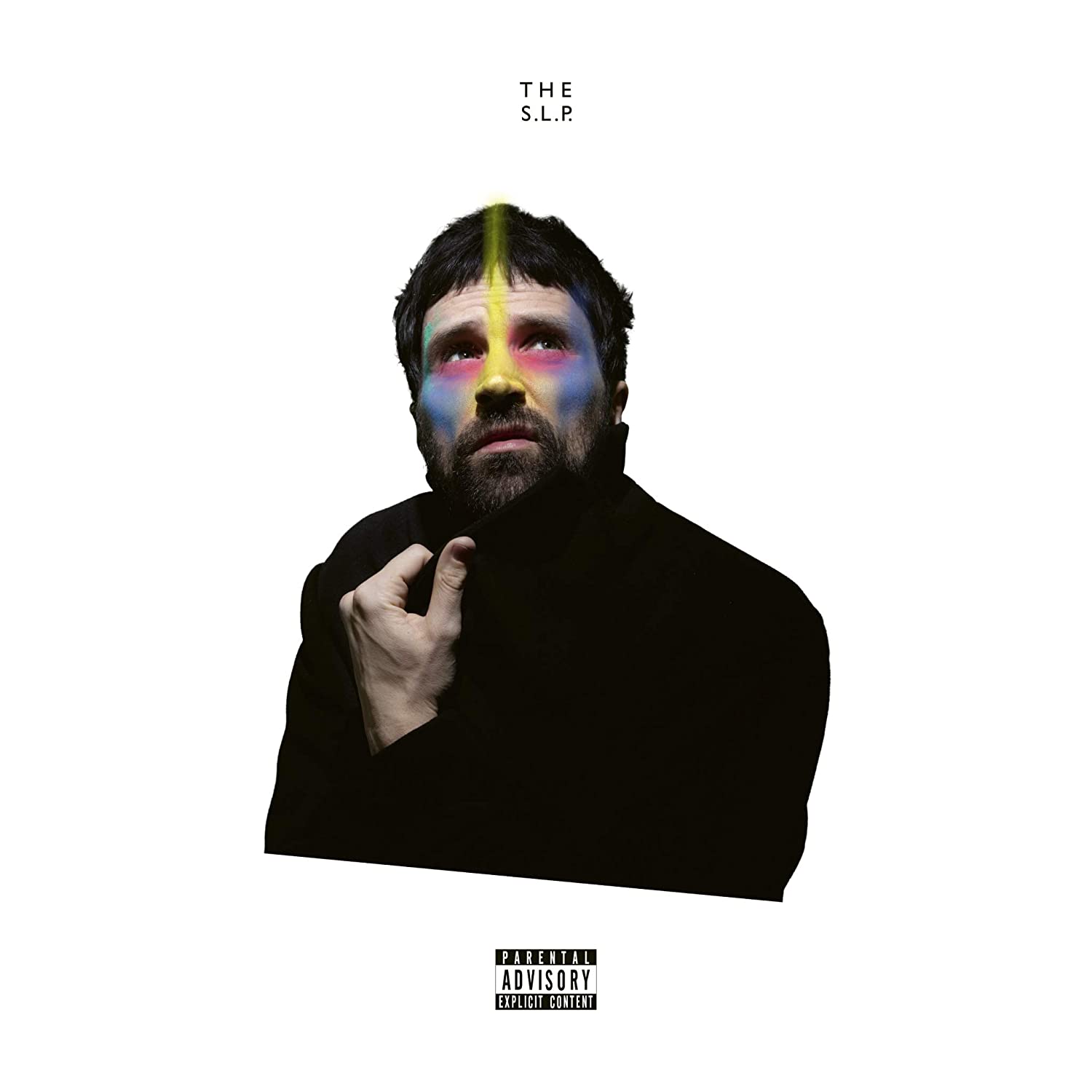 Man in black shirt with rainbow light on face, against white background, parental advisory label.
