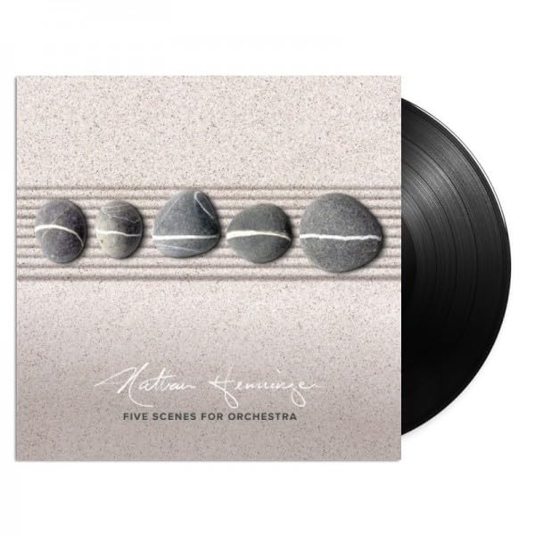 Vinyl record with album cover featuring five polished stones in sand.