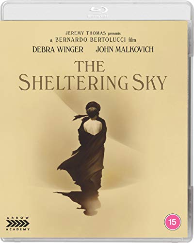 Blu-ray cover for "The Sheltering Sky" featuring a silhouetted woman.
