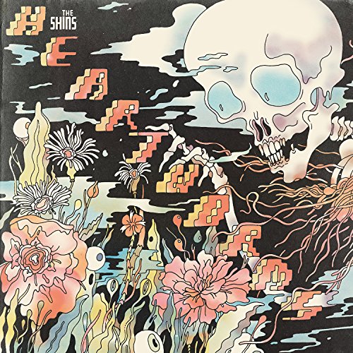 The Shins album cover with a skull and flowers on a black background.