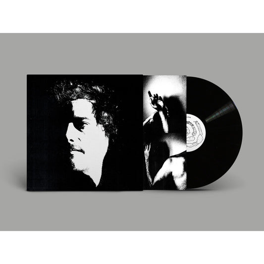 Vinyl record and open album cover with black and white portrait.