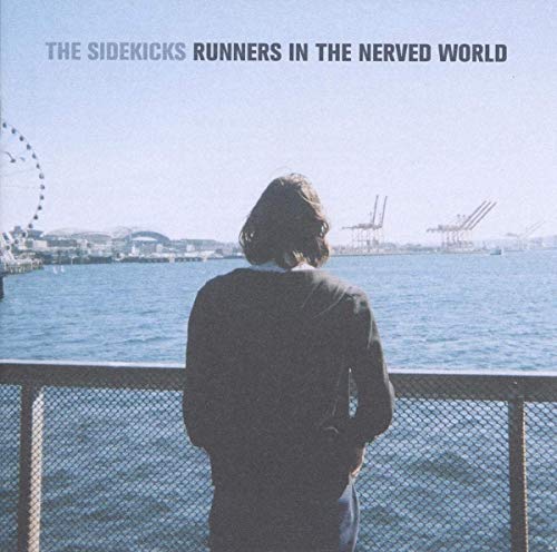 Album cover: person viewed from behind, overlooking water and city.