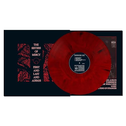 Red and black marbled vinyl record resting on its dark album cover.