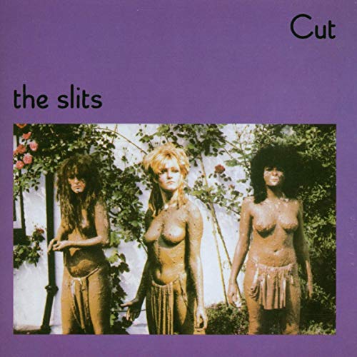 The Slits Cut album cover featuring three women covered in mud against a garden wall.