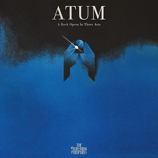 Album cover for "Atum" by The Smashing Pumpkins, featuring a hand holding a broken clock.