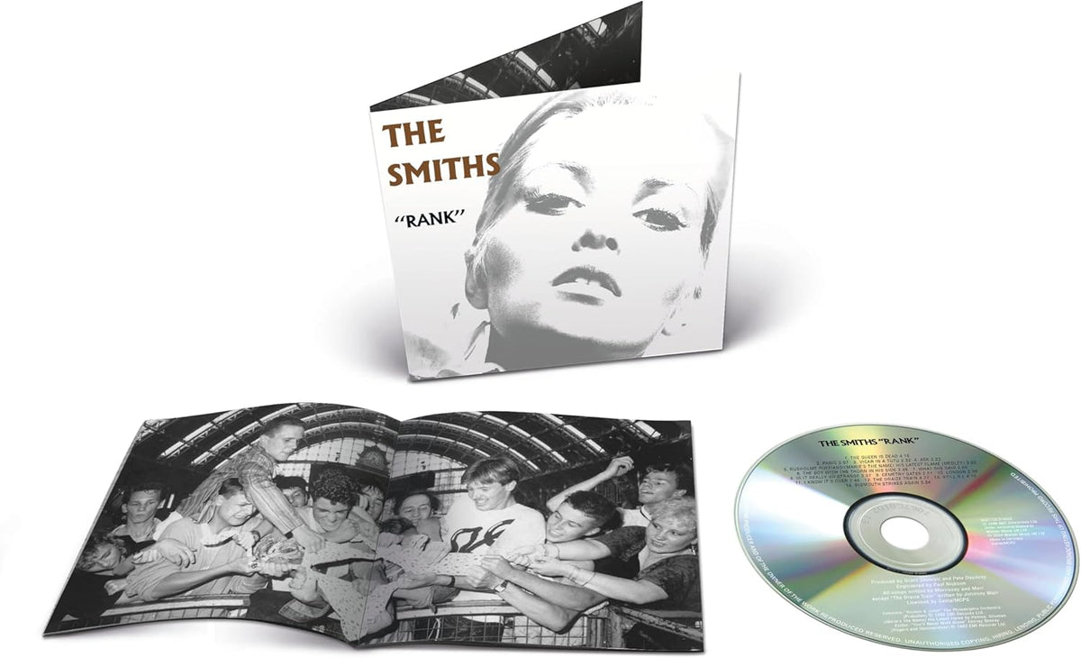 The Smiths "Rank" CD case open with disc, featuring a portrait and group photo.