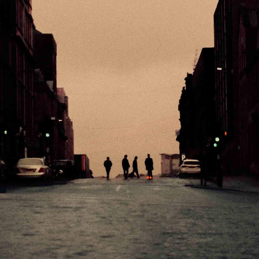 Album cover featuring a dark city street scene with silhouetted figures.