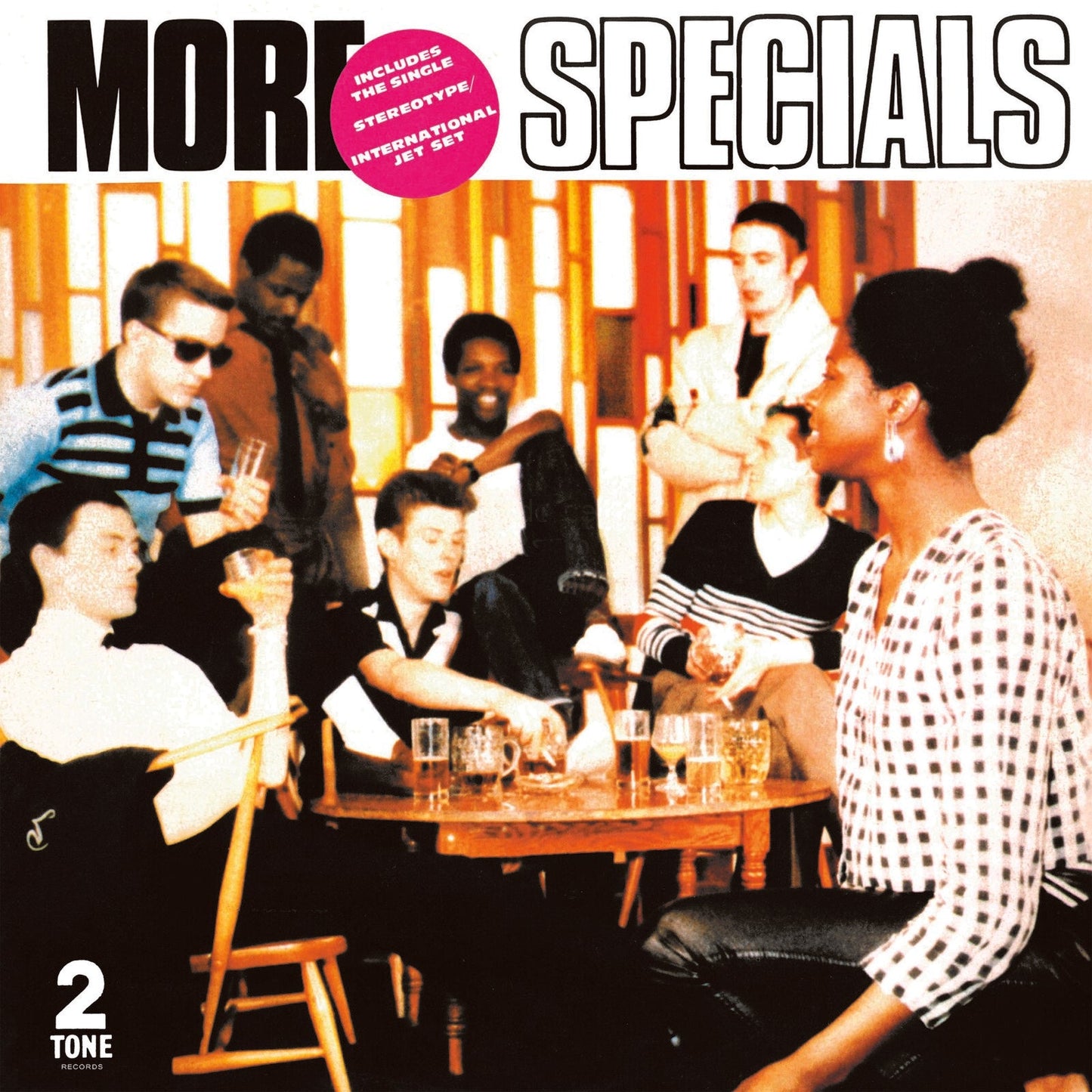Album cover for The Specials More Specials showing a group of people in a pub.