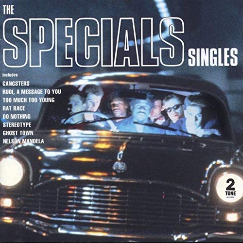 The Specials Singles album cover featuring band members inside a dark vintage car.