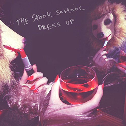 Album cover for The Spook School’s “Dress Up” featuring figures in animal masks.