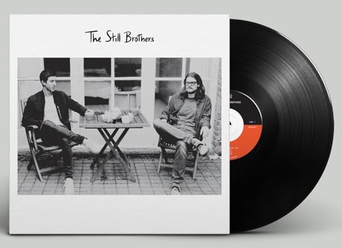 Black vinyl record with cover showing two men in a black and white photo.