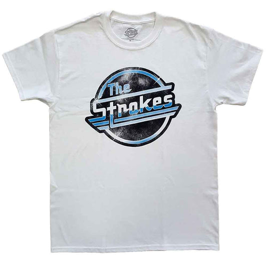 A man wearing a white t-shirt with a distressed blue The Strokes logo.