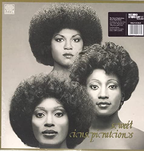 Album cover featuring three women with large afro hairstyles.
