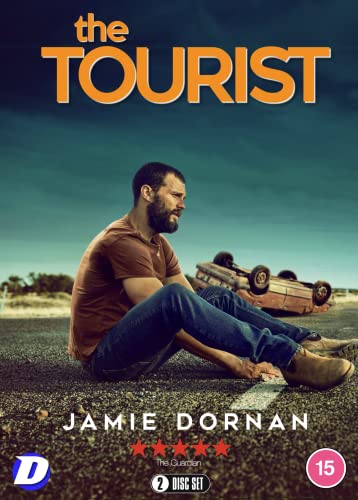 DVD cover for "The Tourist" featuring Jamie Dornan and a wrecked car.