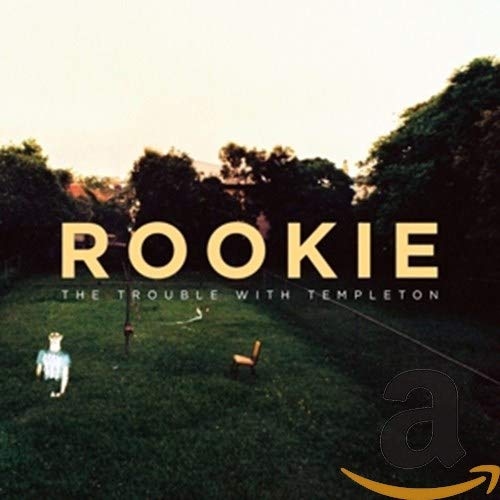 Rookie album cover with text, a lawn, a chair, and a figure.