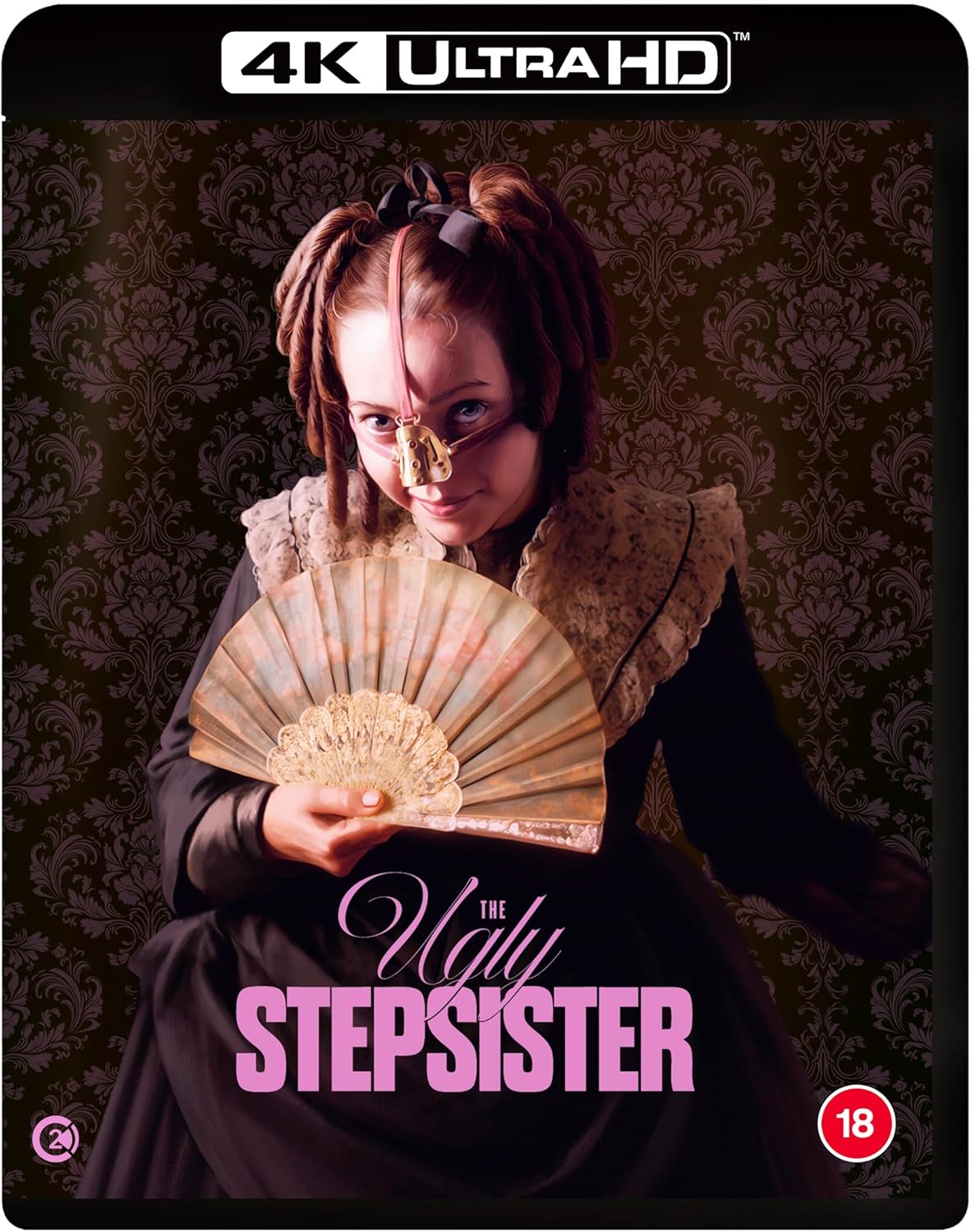 A woman in a Victorian dress holds a fan, wearing a nose-bridge accessory.