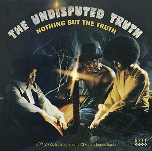 Three people sit around a candle in a dark setting on this CD cover.