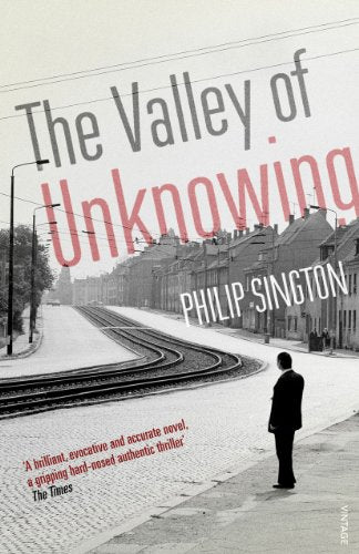 Book cover: street scene with a man standing by train tracks.