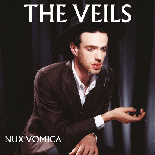Album cover for The Veils’ “Nux Vomica” featuring a man in a suit and hat.