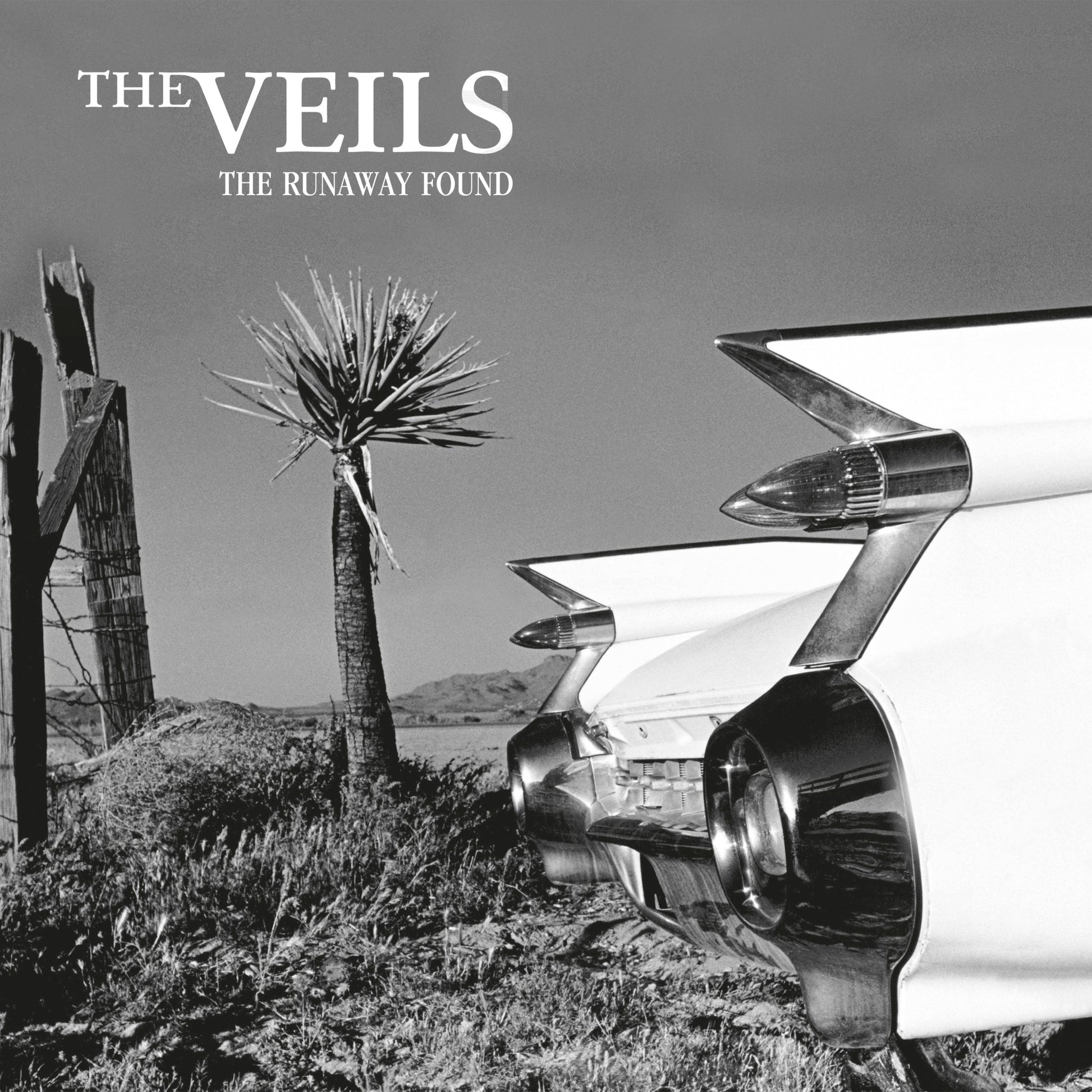 Black and white album cover featuring a vintage car and desert landscape.