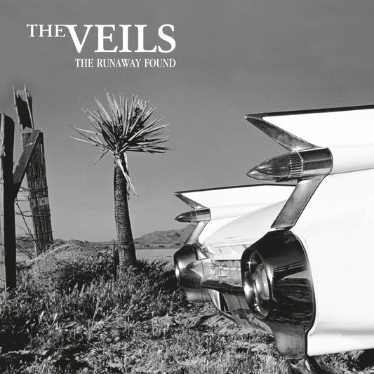 Black and white album cover featuring a vintage car and desert landscape.