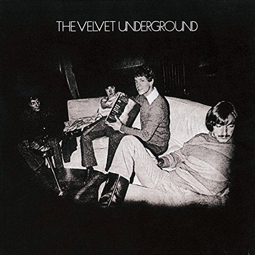 Black and white album cover with three people on a couch.