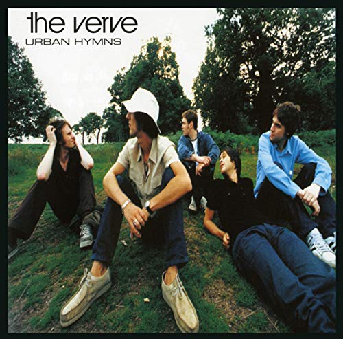 The Verve’s “Urban Hymns” album cover: band members relaxing on grass.