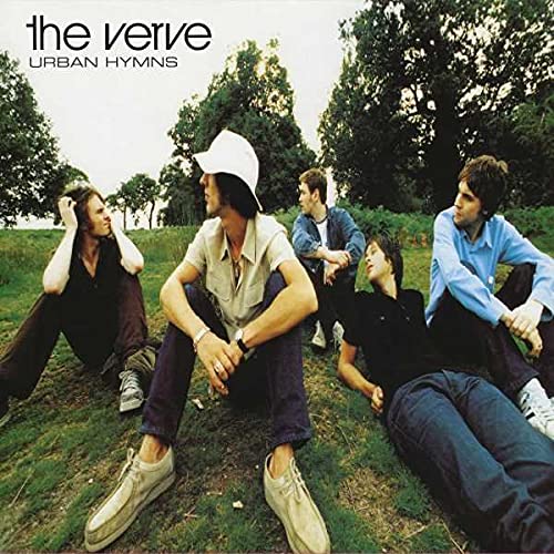 Album cover for The Verve’s “Urban Hymns” featuring four people in a field.