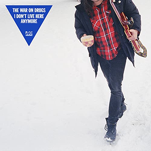 Album cover for The War on Drugs, featuring a man walking in snow.